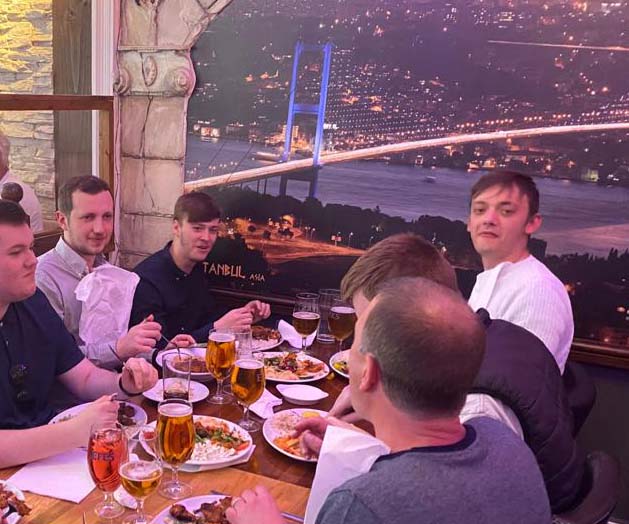 514ac194-024f-41ee-871a-c57d1ba75f15 Staff at table